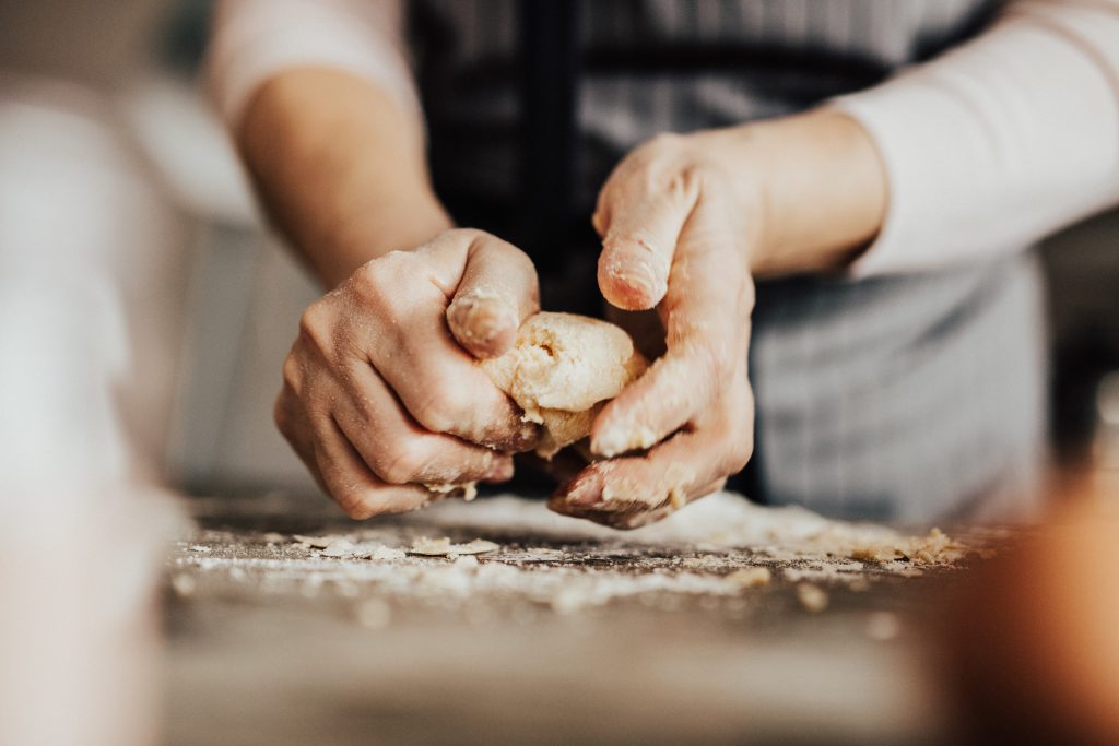 Hands baking bread